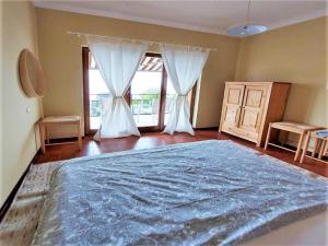 A bed or beds in a room at Belvilla by OYO PAN03 3 - Residenza Panorama