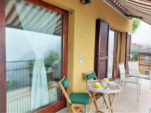 A balcony or terrace at Belvilla by OYO PAN03 3 - Residenza Panorama
