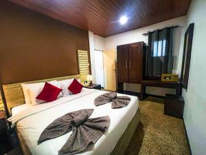 Postel nebo postele na pokoji v ubytování Hotel 198 Negombo + 37 fotografií