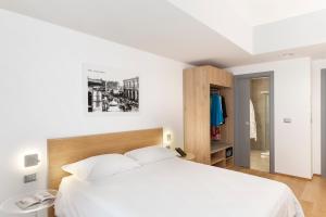 Postel nebo postele na pokoji v ubytování Victor Hotel + 15 fotografií