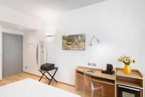 Postel nebo postele na pokoji v ubytování Victor Hotel