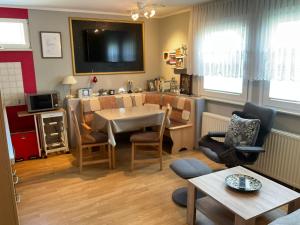 a living room with a table and a dining room at Ferienwohnungen "Strand & Gut" - Dietmar Opel in Zempin +60 photos