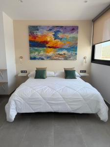 Hotel Playa de la Plata客房内的一张或多张床位