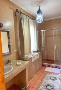 a large bathroom with a sink and a shower at Villa Essalah & Spa in Marrakech +54 photos