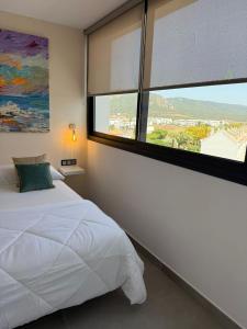 Hotel Playa de la Plata客房内的一张或多张床位
