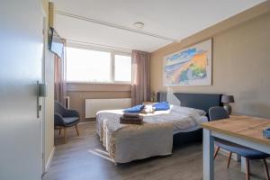 Postel nebo postele na pokoji v ubytování B&B Plompetorenzicht