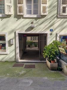 an entrance to a building with an open door at Home Art & Design in Trieste +14 photos