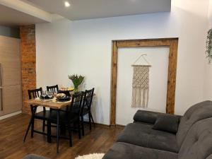 a living room with a couch and a table at Kreutzwaldi Kodu 1 in Võru
