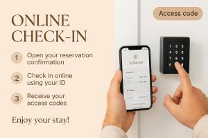 a person holding a cell phone in front of a door at ADANAR-Apartamentos Muralla Zirí in Granada