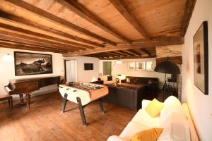 a living room with a ping pong table in it at Domaine Argia in Sames
