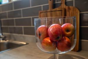 a glass bowl filled with apples sitting on a counter at Garden View in York