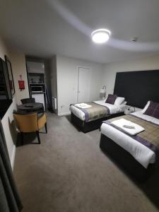 Voodi või voodid majutusasutuse Dalkeith Aparthotel toas