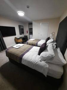 Voodi või voodid majutusasutuse Dalkeith Aparthotel toas