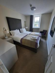 Voodi või voodid majutusasutuse Dalkeith Aparthotel toas