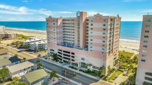an aerial view of the beach and buildings at All New Oceanfront Luxury w Lazy River in Myrtle Beach