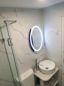 a bathroom with a sink and a mirror at Natural Cottage Una in Bihać