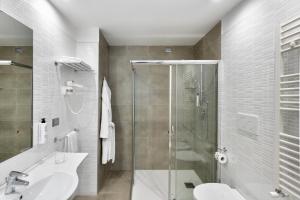 Koupelna v ubytování Victor Hotel