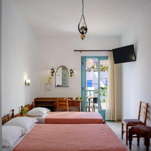 A bed or beds in a room at Armonia