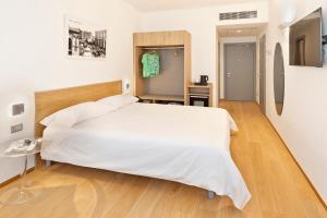Postel nebo postele na pokoji v ubytování Victor Hotel
