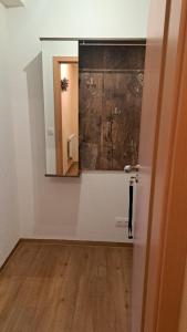 a bathroom with a mirror and a sink in a room at Ferienwohnungen Reiterhof Lienemann in Grünbach +30 photos