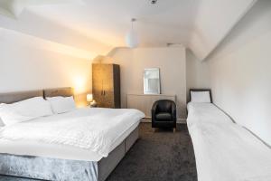 Postel nebo postele na pokoji v ubytování OYO A Better Night Hotel Limited