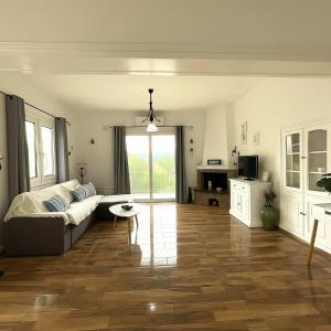 a living room with a couch and a table at Live the Summer Dream at Gaios Cozy Retreat in Gaios