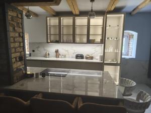 a kitchen with a table and chairs in a room at Mierunia Nature in Mieruniszki +21 photos
