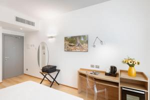Postel nebo postele na pokoji v ubytování Victor Hotel