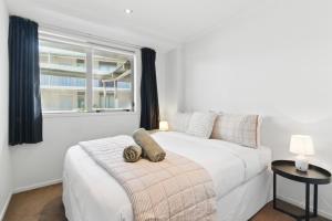 Ένα ή περισσότερα κρεβάτια σε δωμάτιο στο Uptown The Mount at Algarve Apartments