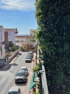 a row of cars parked in a parking lot at LA CALA TROCADERo in Cala del Moral