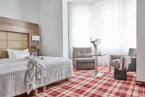Postel nebo postele na pokoji v ubytování Hotel Binzer Hof + 7 fotografií