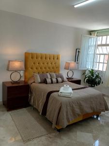 Ένα ή περισσότερα κρεβάτια σε δωμάτιο στο Casa Esmeralda