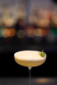 a martini glass with a green garnish on top at Le Relais de Saint de Ser in Puyloubier +14 photos