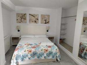 Postel nebo postele na pokoji v ubytování Apartaments IXA