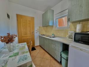 Kuchyň nebo kuchyňský kout v ubytování Apartman Frane