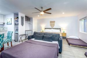 a living room with a couch and a bed at Tranquil Riverfront Studio in Three Rivers