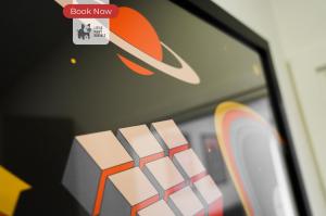 a close up of a chair with a sticker on a window at 2 Bedroom Apartment By Littlepiggyrentals Short Lets & Serviced Accommodation Stevenage With Free Parking, Gym & Roof Garden in Stevenage +9 photos