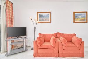 TV a/nebo společenská místnost v ubytování Nerja Townhouse Burriana