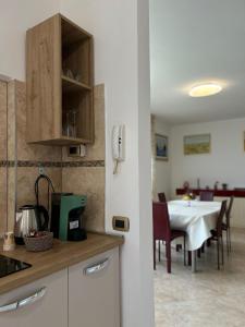a kitchen with a table and a dining room at Skyline Verona in Verona