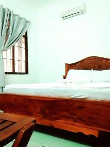 En eller flere senge i et værelse på DIỆP NGỌC MAI Guest House