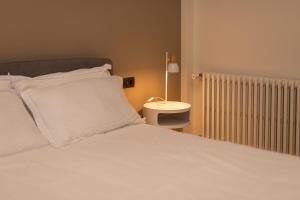 Letto o letti in una camera di Grancini Suite