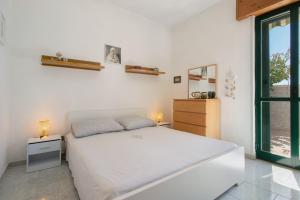 Postel nebo postele na pokoji v ubytování Villa Lelia