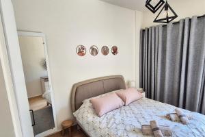 En eller flere senge i et værelse på City Vibes 24-7 Elec BoHome