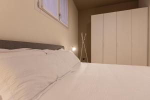 Letto o letti in una camera di Grancini Suite