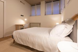 Letto o letti in una camera di Grancini Suite