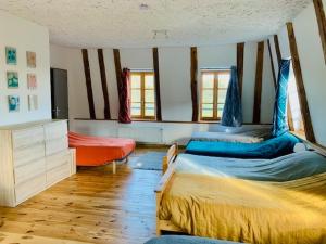 a bedroom with two beds in a room at Le gîte du Brusquet in Antrenas