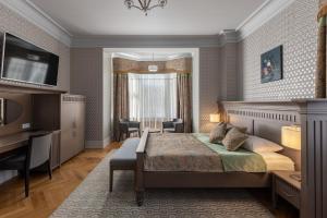 Postel nebo postele na pokoji v ubytování Roze Boutique Hotel