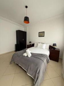 a bedroom with a bed with two towels on it at la perle de tanger in Tangier