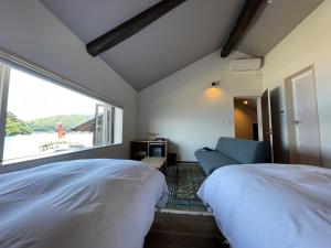 Letto o letti in una camera di 舟屋の宿鍵屋 別館おふくわけ