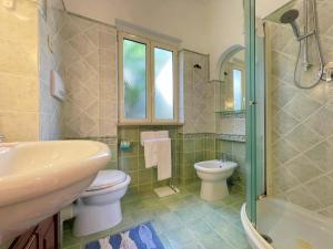 a bathroom with a sink and a toilet and a shower at Ammiraglio in Campese +171 photos